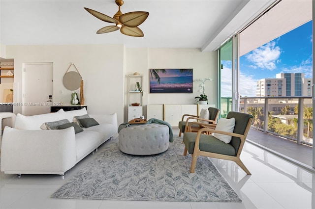 tiled living room featuring floor to ceiling windows and ceiling fan