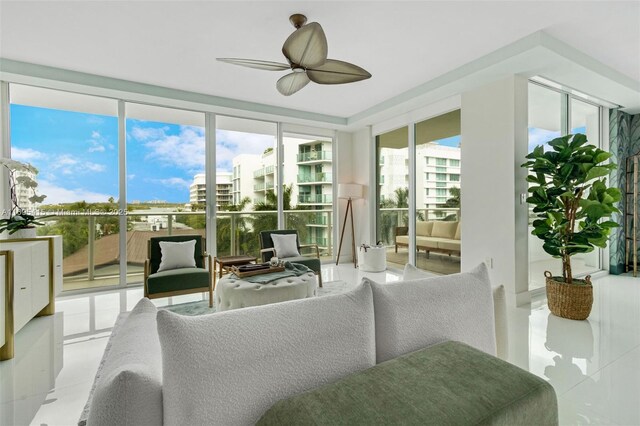 sunroom featuring ceiling fan