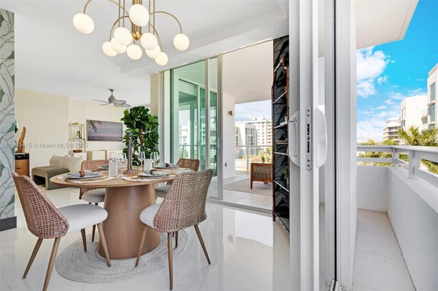 dining area with ceiling fan with notable chandelier and light tile patterned flooring