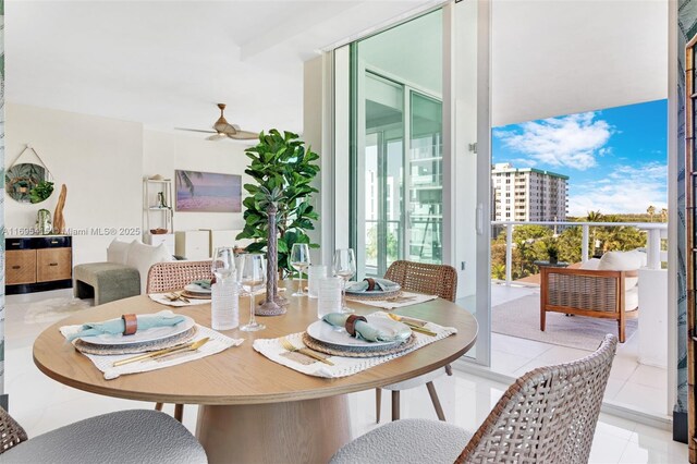 dining space with ceiling fan and light tile patterned floors