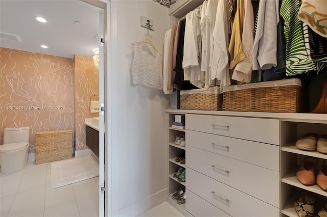 walk in closet featuring light tile patterned floors