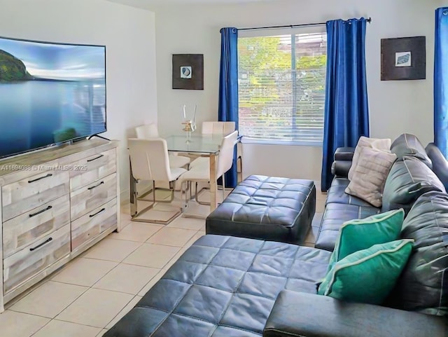 living room with tile patterned flooring and plenty of natural light