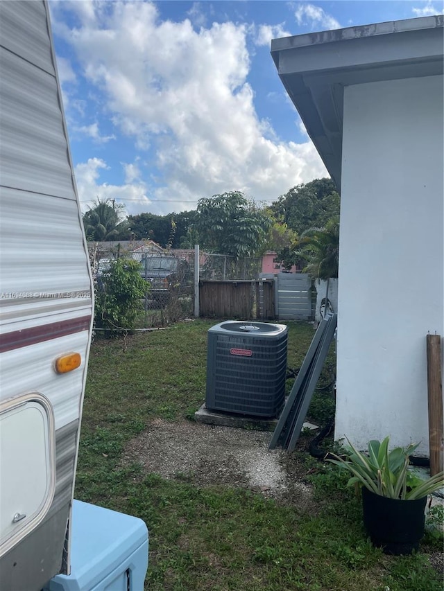 view of yard with central air condition unit