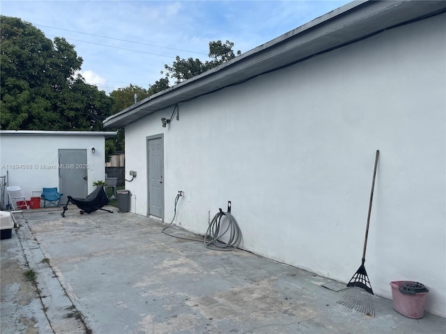 view of side of home featuring a patio area