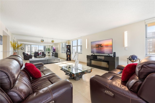 tiled living room with a textured ceiling