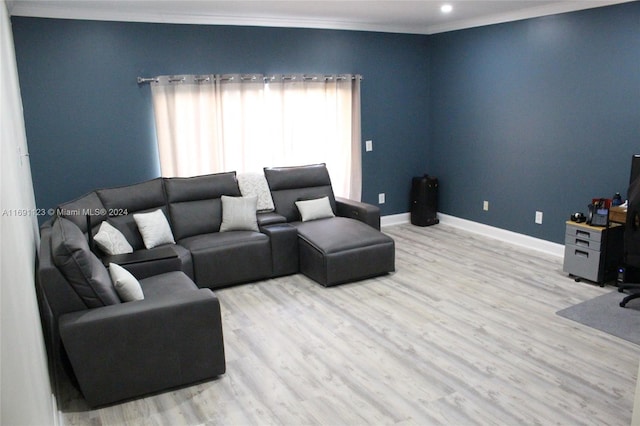 living room featuring crown molding and light hardwood / wood-style flooring