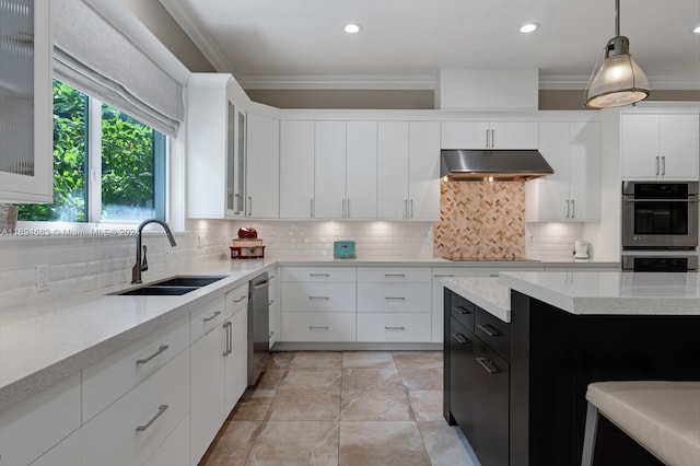 kitchen with decorative backsplash, ornamental molding, sink, decorative light fixtures, and white cabinetry