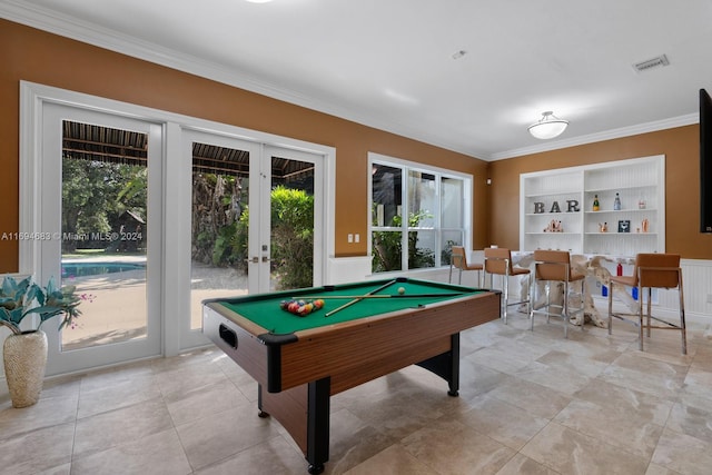 playroom featuring built in shelves, ornamental molding, billiards, and french doors