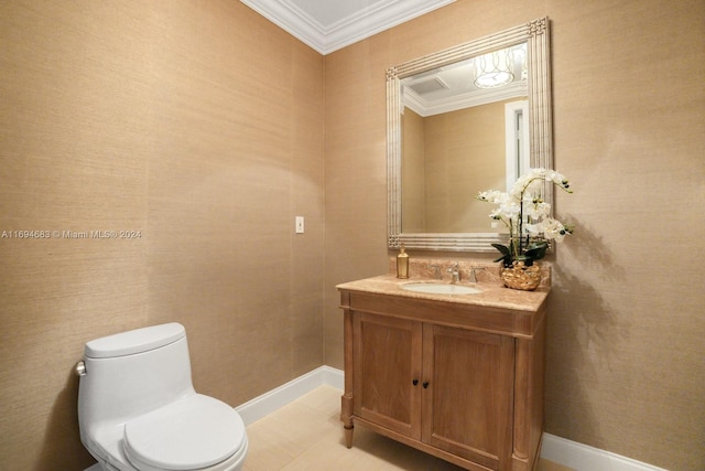 bathroom featuring tile patterned flooring, vanity, ornamental molding, and toilet