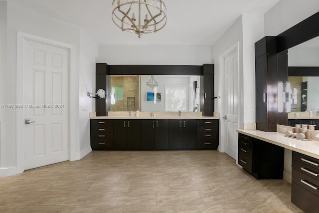 bathroom with vanity and a notable chandelier