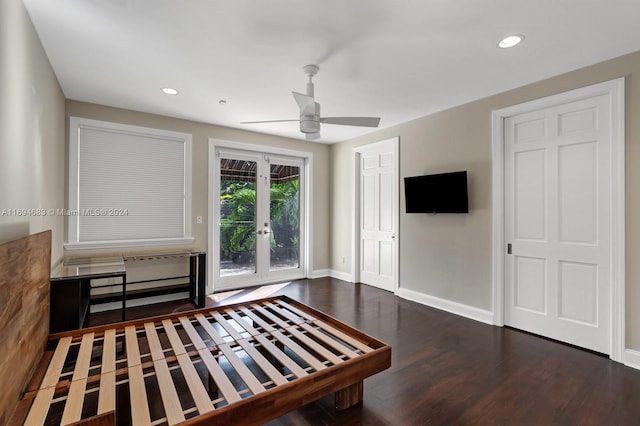 unfurnished living room featuring ceiling fan, dark wood-type flooring, and french doors