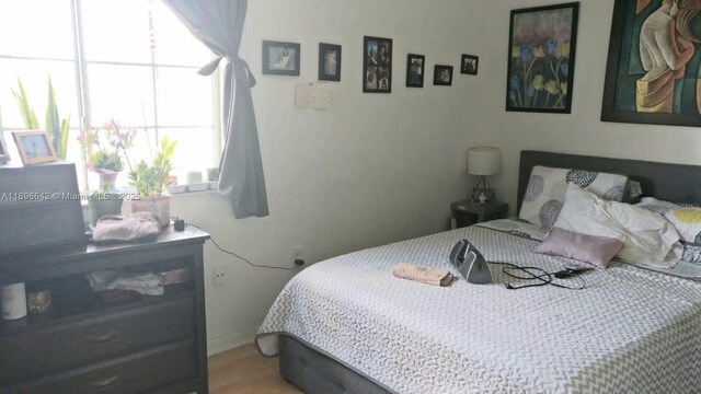 bedroom with wood-type flooring