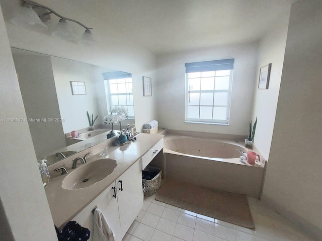 bathroom featuring tile patterned flooring, vanity, and a bathtub