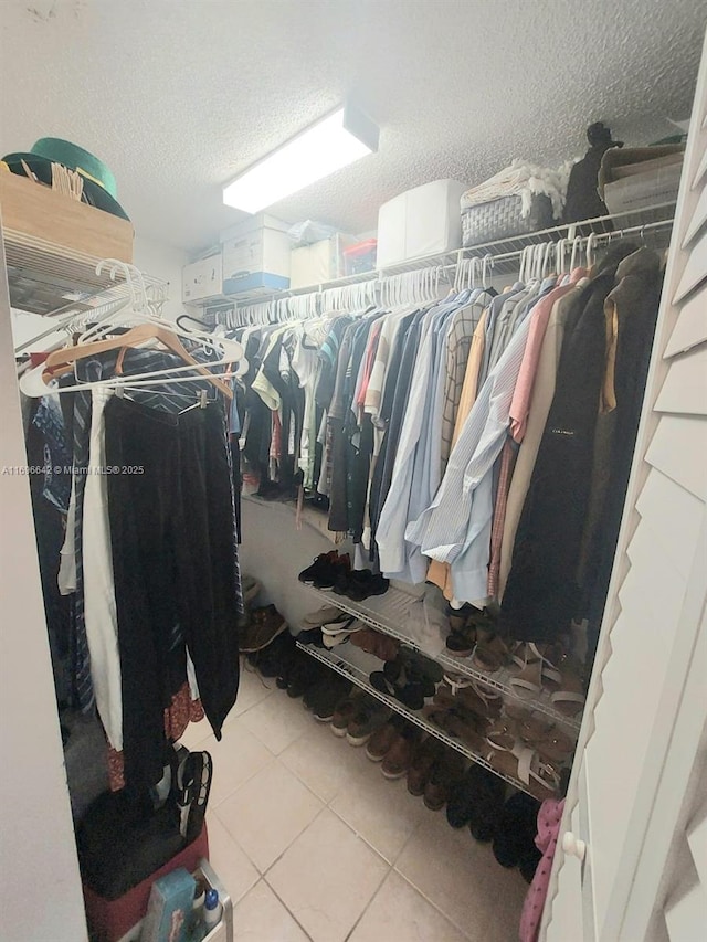 walk in closet featuring light tile patterned floors