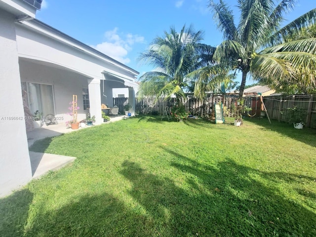 view of yard with a playground