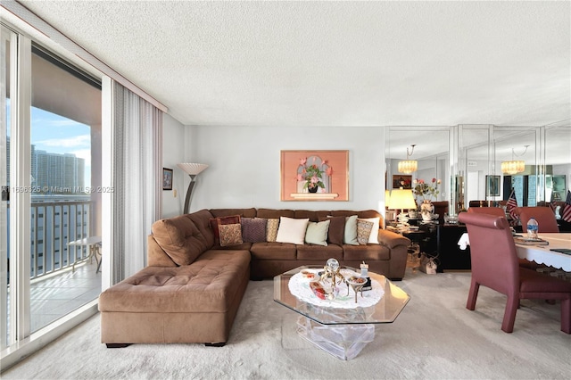 carpeted living area featuring expansive windows and a textured ceiling