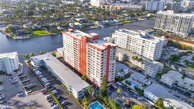 birds eye view of property featuring a water view and a city view