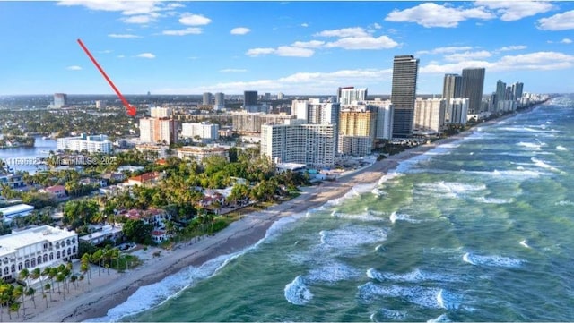 view of city featuring a view of the beach and a water view