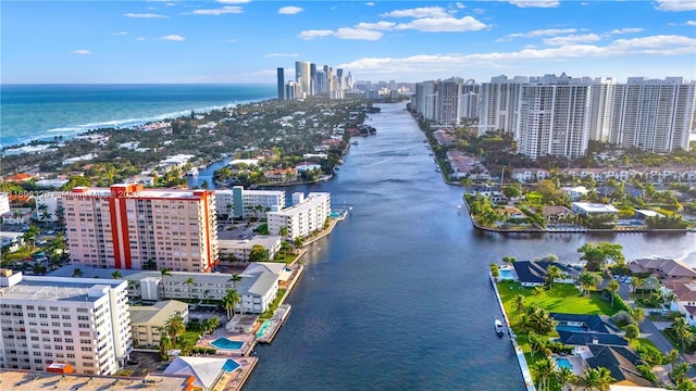 birds eye view of property featuring a view of city and a water view