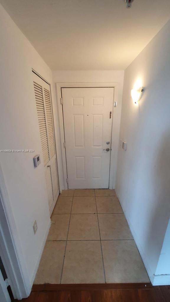 corridor featuring tile patterned floors