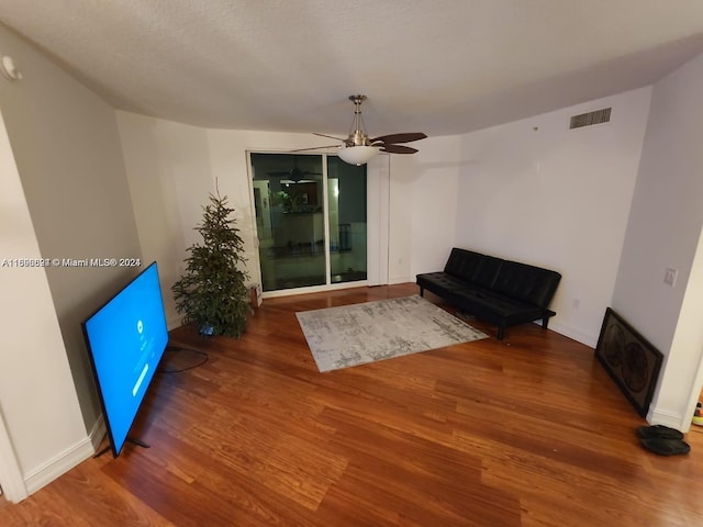 unfurnished room with hardwood / wood-style floors and ceiling fan