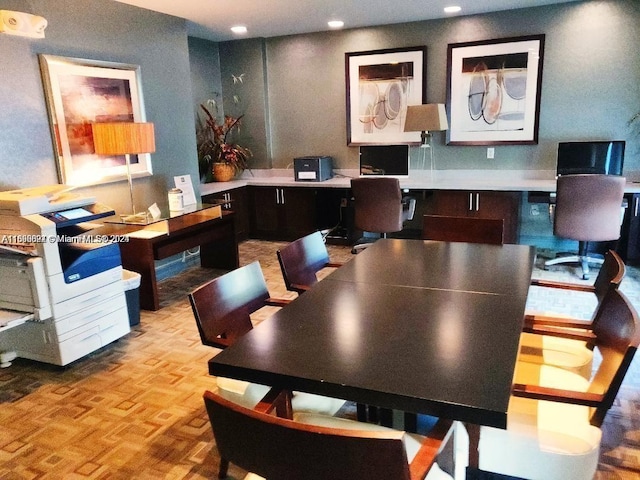 home office featuring built in desk and light parquet floors