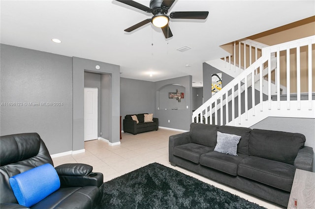 living room featuring tile patterned floors and ceiling fan