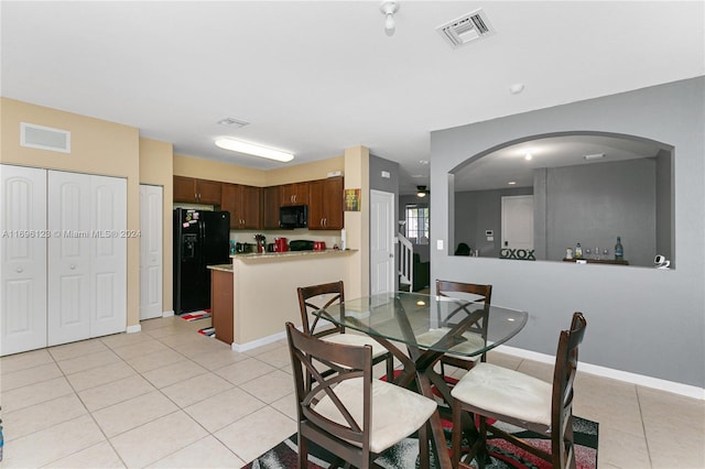 dining space with light tile patterned flooring