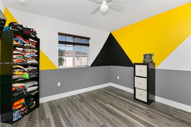 interior space featuring ceiling fan and dark hardwood / wood-style floors