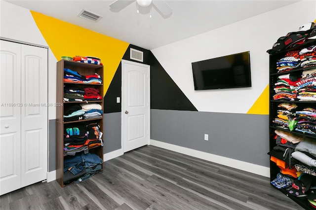 playroom featuring dark hardwood / wood-style floors, ceiling fan, and lofted ceiling