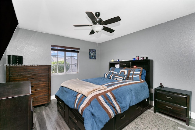 bedroom featuring ceiling fan and light hardwood / wood-style flooring