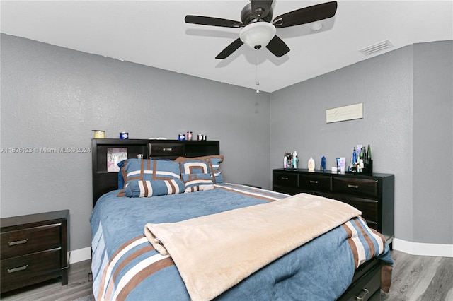 bedroom featuring light hardwood / wood-style flooring and ceiling fan