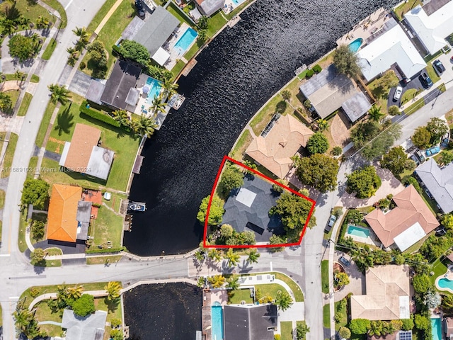 birds eye view of property with a water view