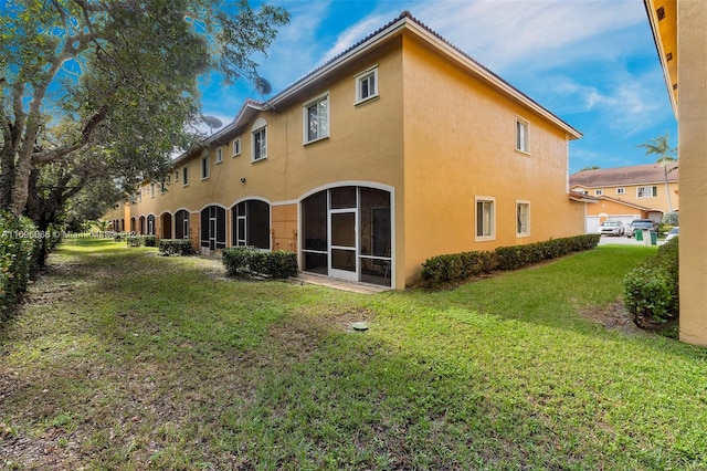 rear view of house with a lawn