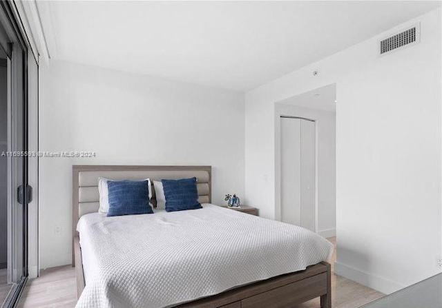 bedroom featuring light hardwood / wood-style floors