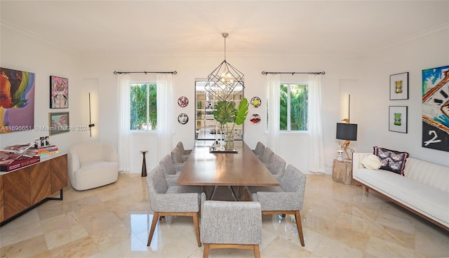 dining area featuring crown molding and a notable chandelier