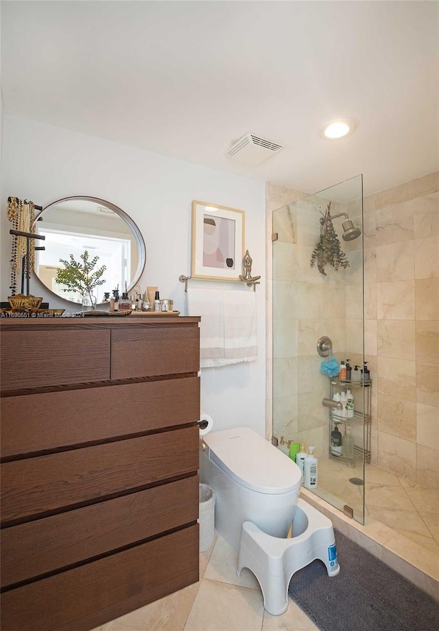 bathroom with toilet, tile patterned floors, and walk in shower