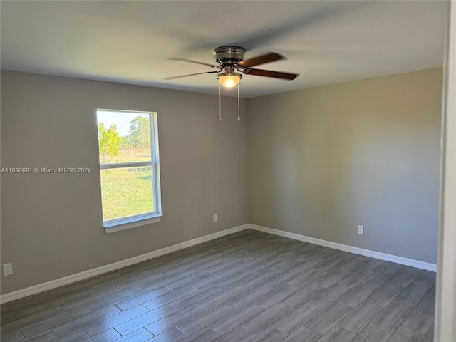 unfurnished room with ceiling fan and light wood-type flooring