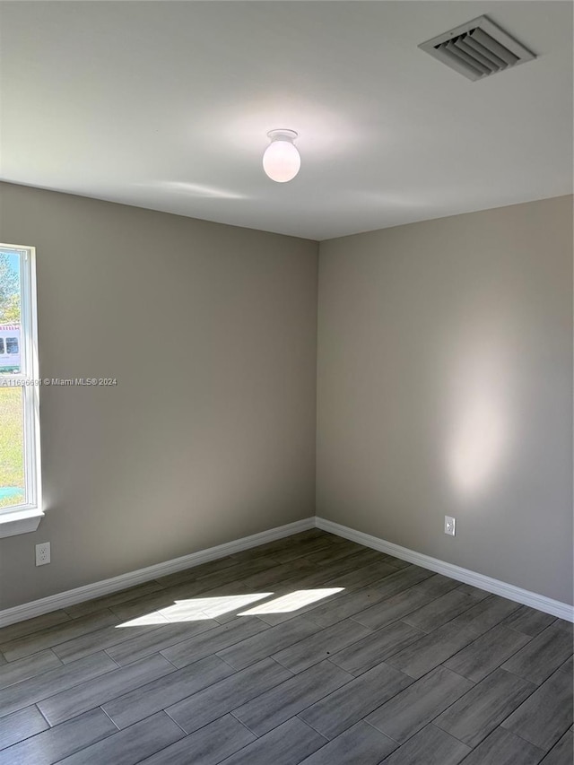 unfurnished room featuring light wood-type flooring