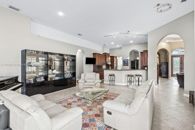 living room with french doors and track lighting