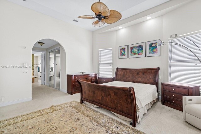 carpeted bedroom with ceiling fan