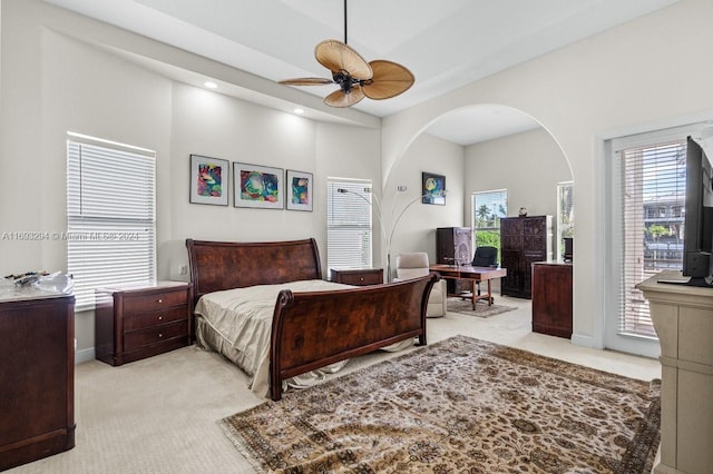 carpeted bedroom featuring access to exterior and ceiling fan