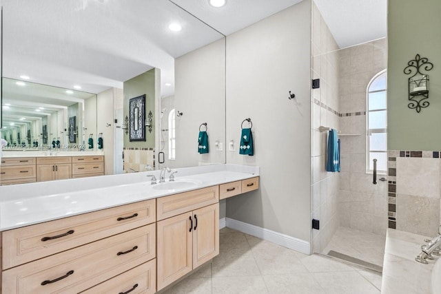 bathroom featuring tile patterned flooring, vanity, and a shower with shower door