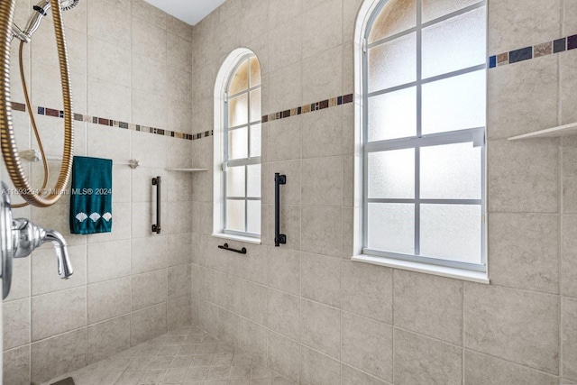 bathroom with a tile shower