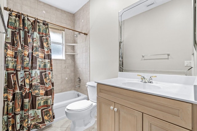 full bathroom with tile patterned flooring, vanity, shower / tub combo, and toilet