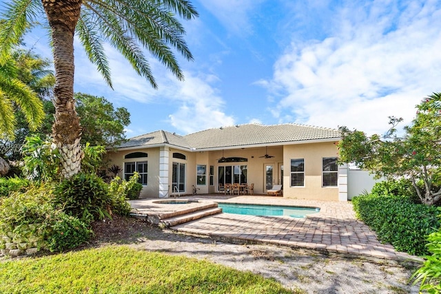 back of property featuring a patio and ceiling fan