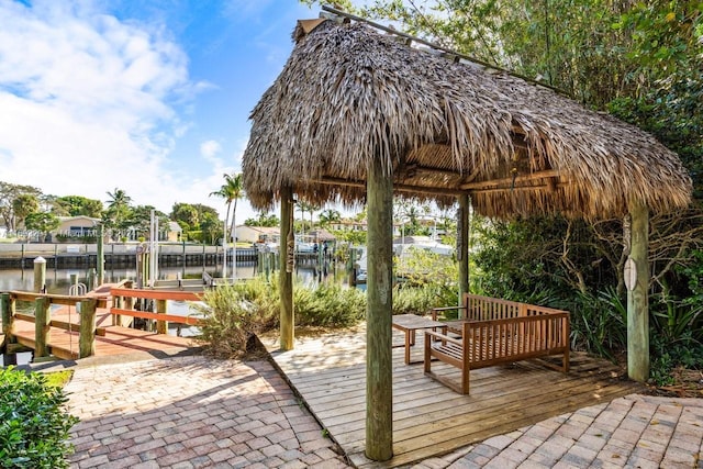 view of home's community with a dock and a water view