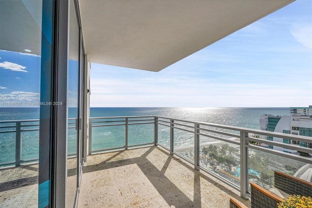 balcony featuring a water view