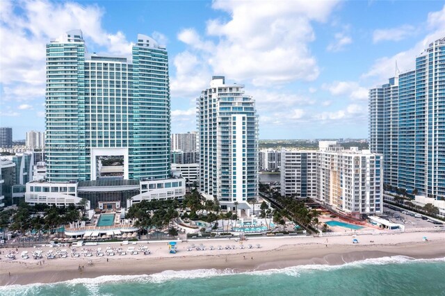 property's view of city featuring a beach view and a water view