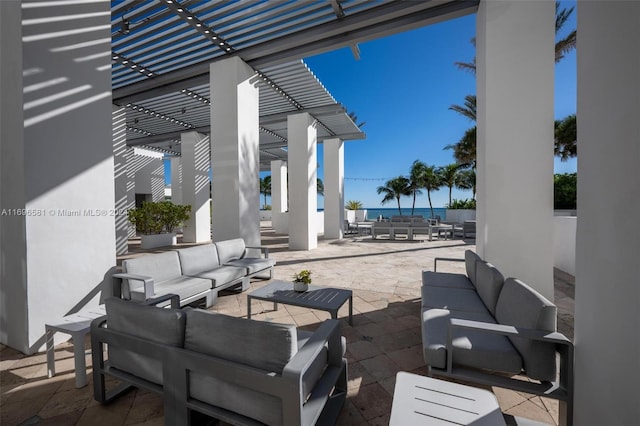 view of patio featuring a pergola, an outdoor living space, and a water view